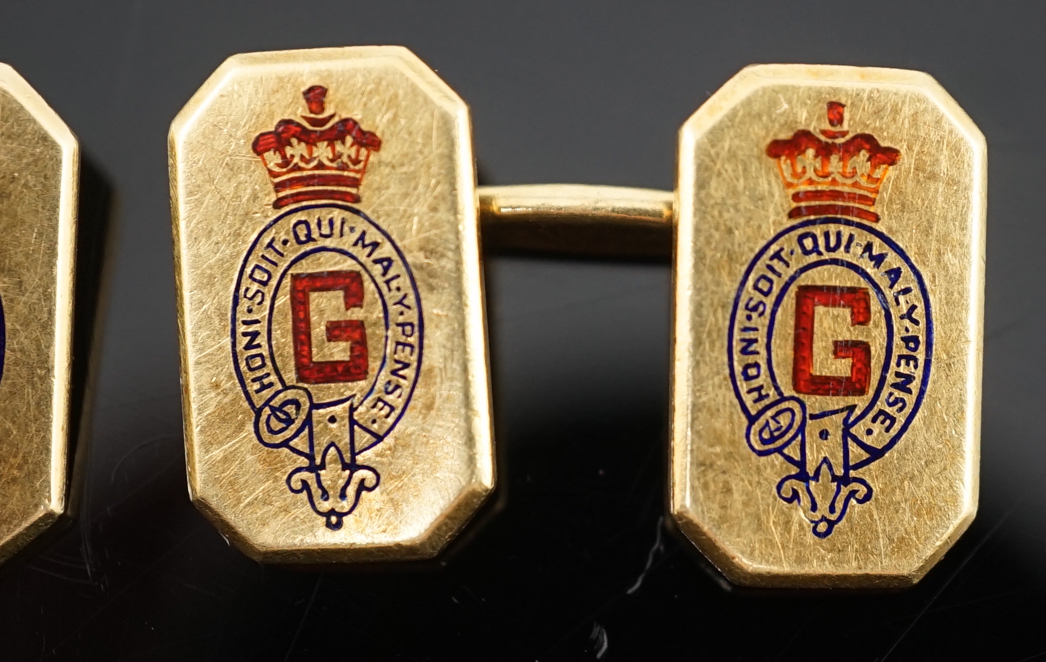 A pair of 1920's/1930's Cartier gold and two colour enamel rectangular Regimental cufflinks, with canted corners